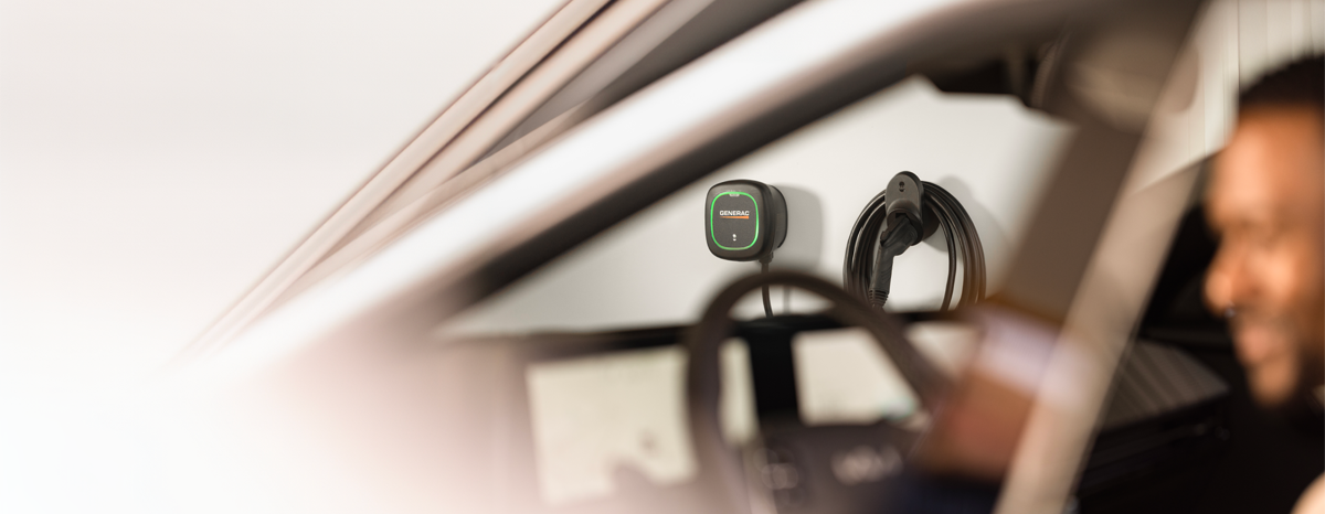 Generac EV Charger shown installed in the background of a garage